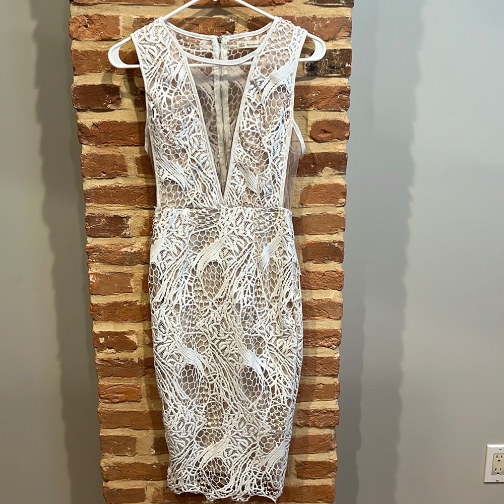 White lace dress with shear nude cutouts